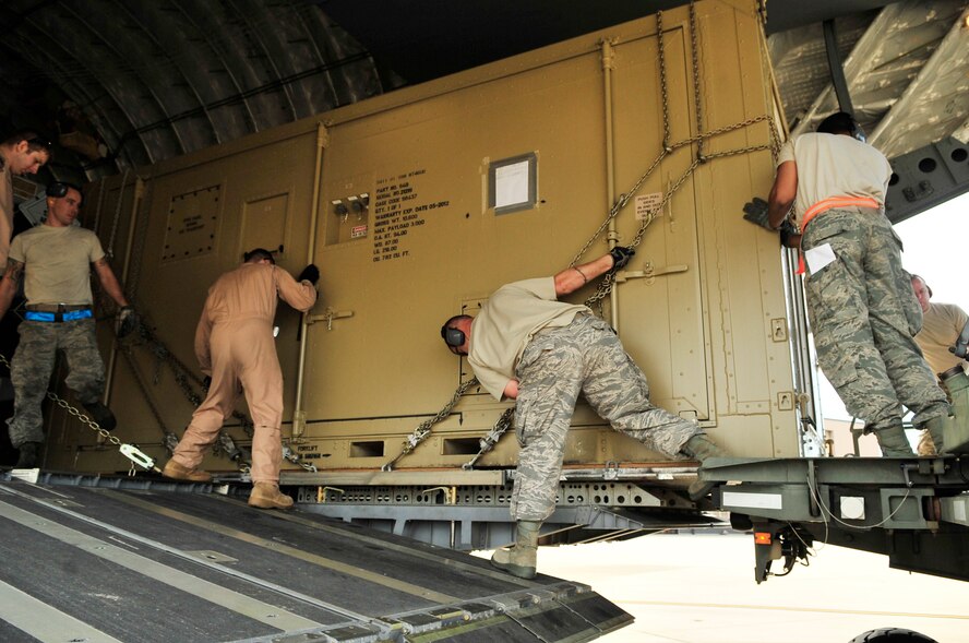 Team Shaw members from the 20th Logistics Readiness sqaudron load cargo onto a C-17 Globermaster IIIfor a deployment to an undisclosed location in Southwest Asia from Shaw Air Force Base, S.C., Oct. 5, 2012.   (U.S. Air Force photo by Airman Nicole Sikorski/Released)