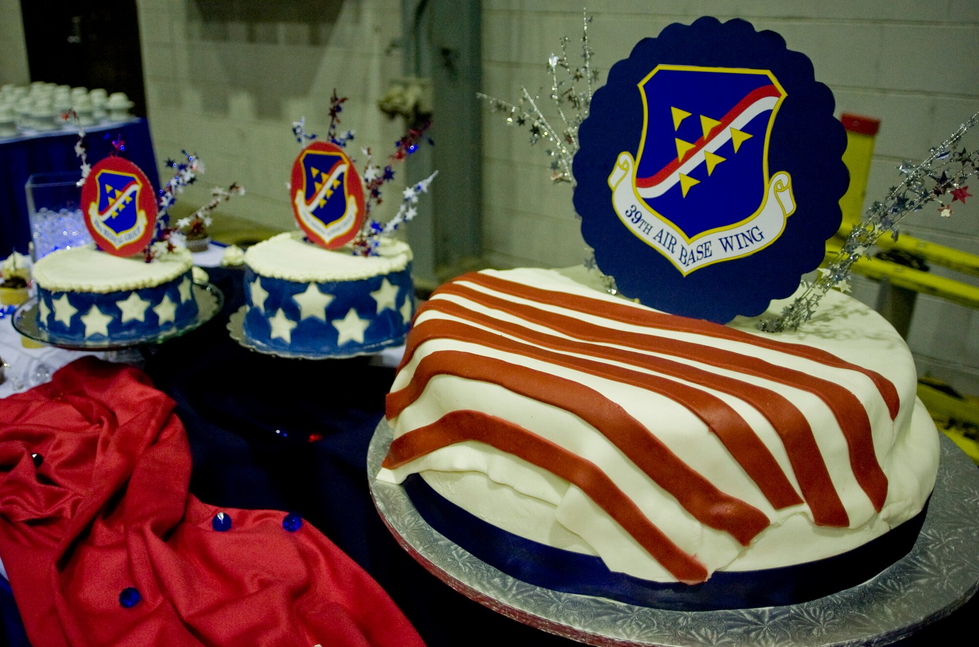 Several cakes and small desserts adorn a table at the Formal Dining-Out ceremony Nov. 3, 2012, at Incirlik Air Base, Turkey. Formal military dinners are a tradition in all branches of the U.S. armed forces, and the dining-out represents one of the most formal aspects of Air Force social life. The ceremony enables military members of all ranks to socialize and enhance working relationships in a professional environment. (U.S. Air Force photo by Senior Airman Anthony Sanchelli/Released)
