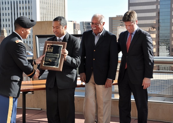 PHOENIX - Rich Fontanilla, the Area Engineer for the U.S. Army Corps of Engineers Los Angeles District's Arizona-Nevada Area Office, receives the Chief of Engineers Award of Excellence for Environmental Design Nov. 1 from Col. Mark Toy, the LA District commander, for work done at the Tres Rios Environmental Restoration Project, Phase II Flow Regulating and Overbank Wetlands while U.S. Representative Ed Pastor and Phoenix Mayor Greg Stanton look on. In partnership with the City of Phoenix and Archer-Western Contractors, Ltd., and Jacobs Engineering Group, Inc.the Corps' project "does an outstanding job of natural treatment for wastewater effluent while providing valuable wetland habitat," according to the write up for the award. 