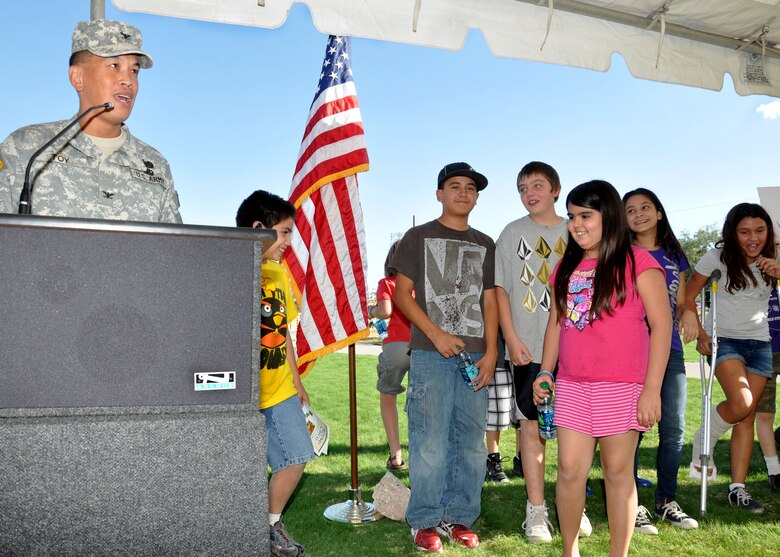 TUCSON, Ariz.- Col. Mark Toy, U.S. Army Corps of Engineers Los Angeles District commander, speaks at the Nov. 2 ribbon-cutting ceremony for the Tucson  Arroyo Project Phase II B Park Avenue Basins project while a group of students from the nearby Highland Free School watches. The project, developed in partnership with the Pima County Regional Flood Control District; the City of Tucson; the Tucson Unified School District and the Corps of Engineers is designed to provide for flood risk management and ecosystem restoration along the Tucson Arroyo within the Arroyo Chico watershed. 