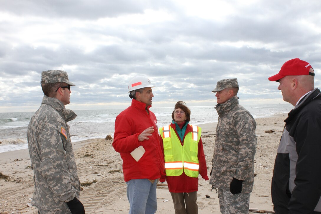 Geotechnical Engineer Rich DePasquale speaks with North Atlantic Division Commander Col. Kent Savre about the Mantoloking breach. DePasquale and a team of USACE engineers are assisting New Jersey close the breach following historic Hurricane Sandy. 