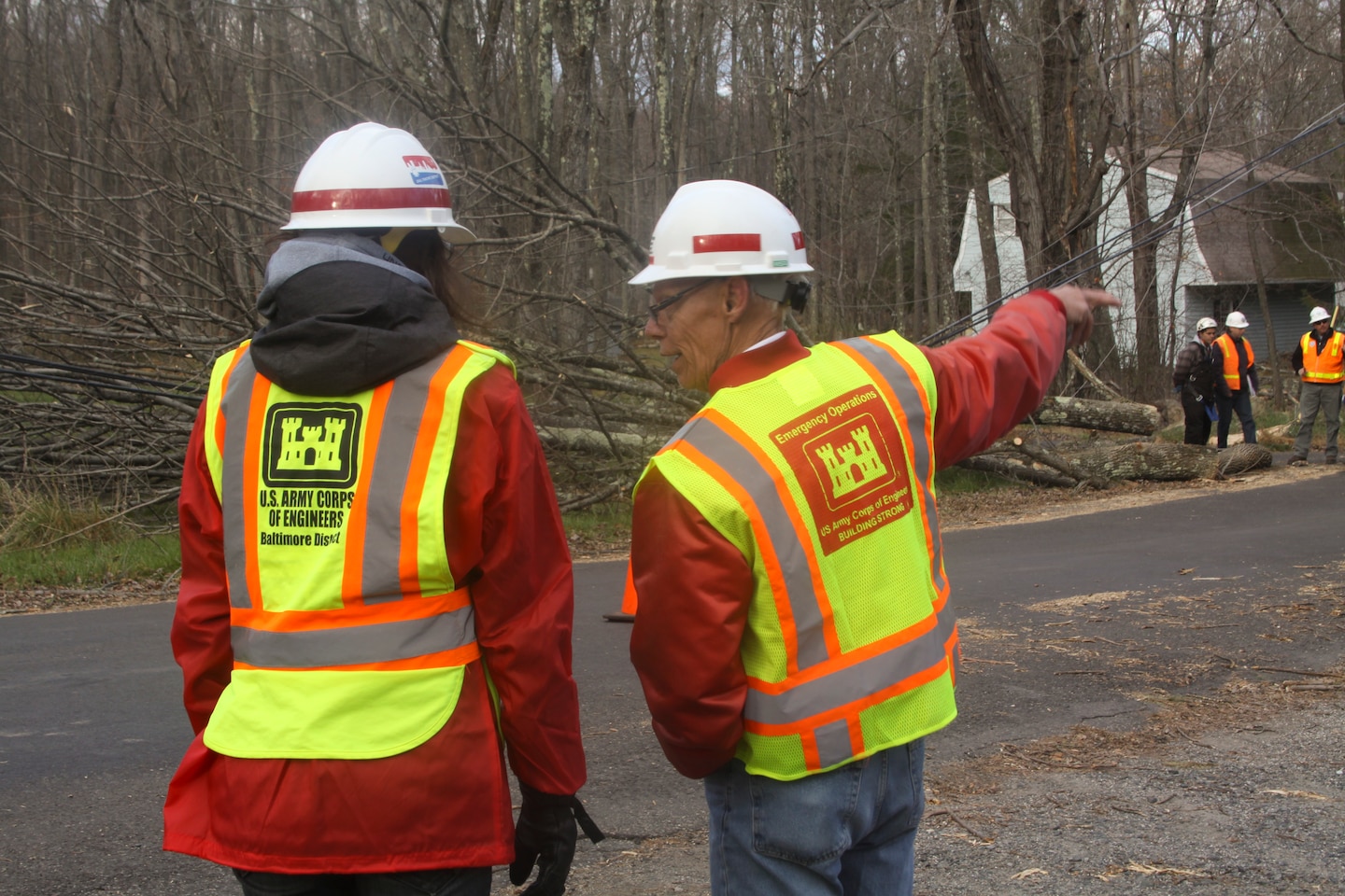 LEBANON TOWNSHIP, NJ – Ashley Kosmal (left), a Baltimore District project engineer, and Joe Hollshwander, a Baltimore District resident engineer, monitors a debris removal crew as they cut away fallen trees from power lines in preparation for power crews to begin to restore power to the area in the wake of Hurricane Sandy. (U.S. Army photo/Patrick Bloodgood)