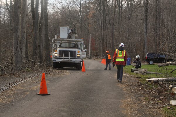 LEBANON TOWNSHIP, NJ – Ashley Kosmal, a Baltimore District project engineer, monitors a debris removal crew as they cut away fallen trees from power lines in preparation for power crews to begin to restore power to the area in the wake of Hurricane Sandy. (U.S. Army photo/Patrick Bloodgood)