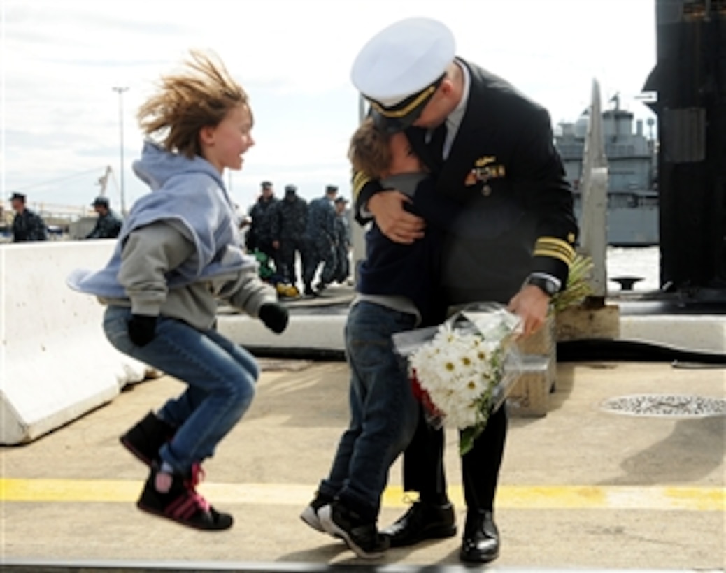 Children express their excitement as they welcome home their father from a six-month deployment of the Los Angeles-class attack submarine USS Norfolk (SSN 714) at Naval Station Norfolk, Va., on Nov. 3, 2012.  The submarine transited more than 30,000 nautical miles and conducted port visits to Israel, Cyprus, Bahrain and Diego Garcia during the deployment.  