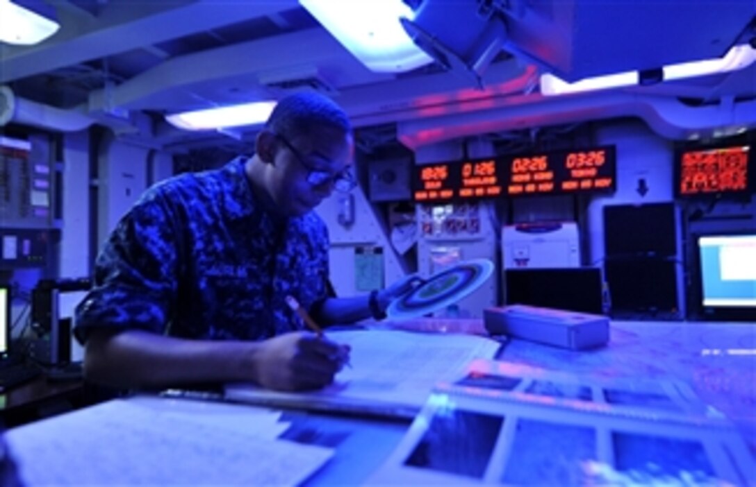 U.S. Navy Airman William Surles uses a dew point calculator in the Meteorology and Oceanic Center aboard the aircraft carrier USS George Washington (CVN 73) as the ship operates in the Philippine Sea on Nov. 5, 2012.  