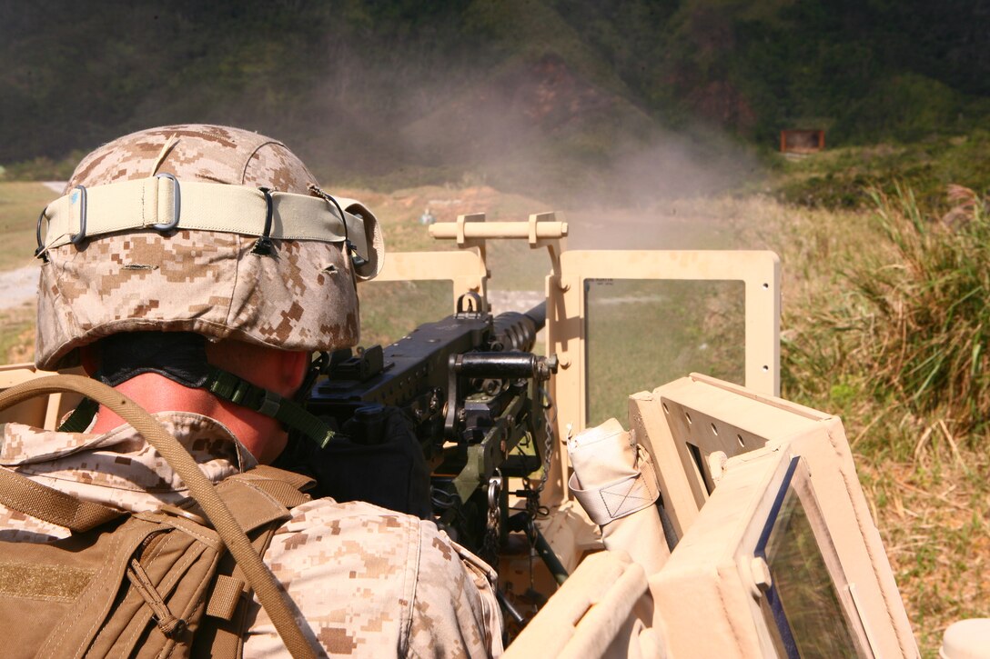 Lance Cpl. Joseph W. Cobb effectively engages a target with a .50-caliber Browning machine gun during crew-served weapons training at Camp Schwab Oct. 24. Cobb is a data systems technician with Combat Logistics Regiment 3, 3rd Marine Logistics Group, III Marine Expeditionary Force.