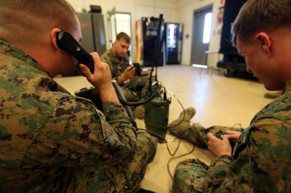 Cpl. James Haynes, from Redding, Calif., Cpl. Travis Miks, from Jackson, Mich., and Cpl. Ryan Neary, from Simi Valley, Calif., all radio operators with the 22nd Marine Expeditionary Unit, familiarize themselves with the AN/PRC-117G Multiband Manpack Radio aboard Marine Corps Base Camp Lejeune, N.C., Nov. 5, 2012. The 22nd MEU recently purchased new equipment and software to familiarize themselves before predeployment training in 2013. 