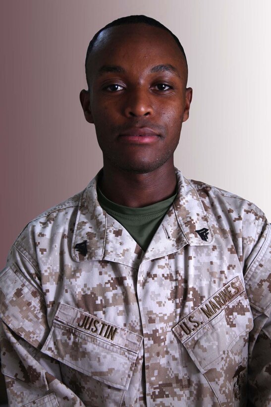 Corporal Pierre K. Justin was born in Port-au-Prince, Haiti, in 1990. At the age of 15, he left the Caribbean and moved to his father's house in New York City. Today he serves as an administration clerk, deployed with the 15th Marine Expeditionary Unit aboard the USS Rushmore. The 15th MEU is deployed as part of the Peleliu Amphibious Ready Group as a theater reserve and crisis response force throughout U.S. Central Command and the U.S. 5th Fleet area of responsibility.