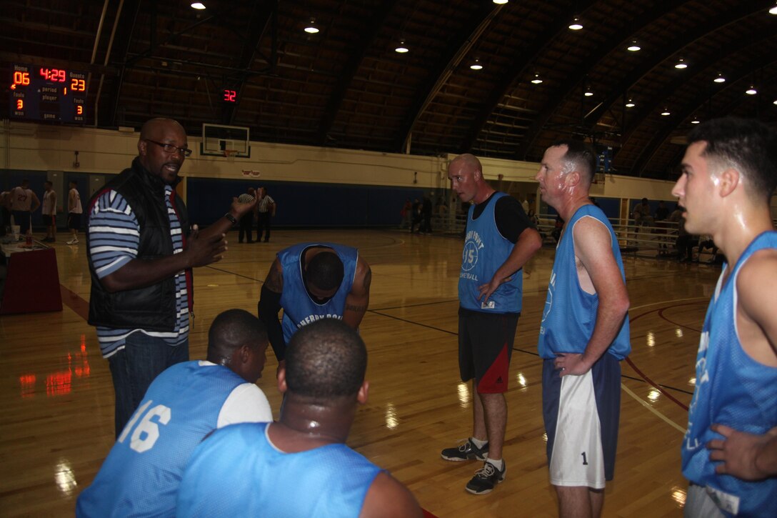 Chris Williams, the coach of the "Expendables," motivates his team during a time out in the 11th game of the intramural basketball season inside the Marine Dome Oct. 29. The Expendables outscored their opponents, the Spartans 58-50. 