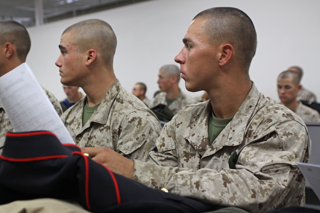 Recruits of Lima Company, 3rd Recruit Training Battalion, recieve their dress blue uniforms aboard Marine Corps Recruit Depot San Diego, Oct. 31. After recieving all their dress uniforms, recruits tried on their uniforms for tailor markings. 