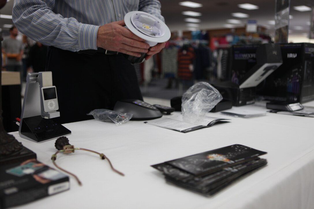 Erik Feus, a Lutron Electronics, Inc. representative, displays some of the electronic products his company had for display at the Energy Fair hosted at the Marine Corps Exchange aboard Marine Corps Base Camp Lejeune Oct 19. Lutron’s booth was one of the many different companies represented at the second annual fair.