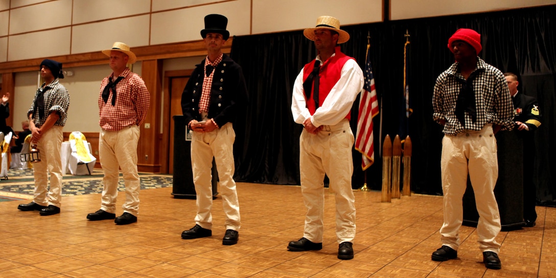 Sailors in historic uniforms recite narrations of the important battles of the War of 1812 during the Navy Ball at the New Bern Convention Center in New Bern, N.C., Oct. 20. The War of 1812 was remembered at the ball because of the important role the Navy had in the success in many of that war’s battles.