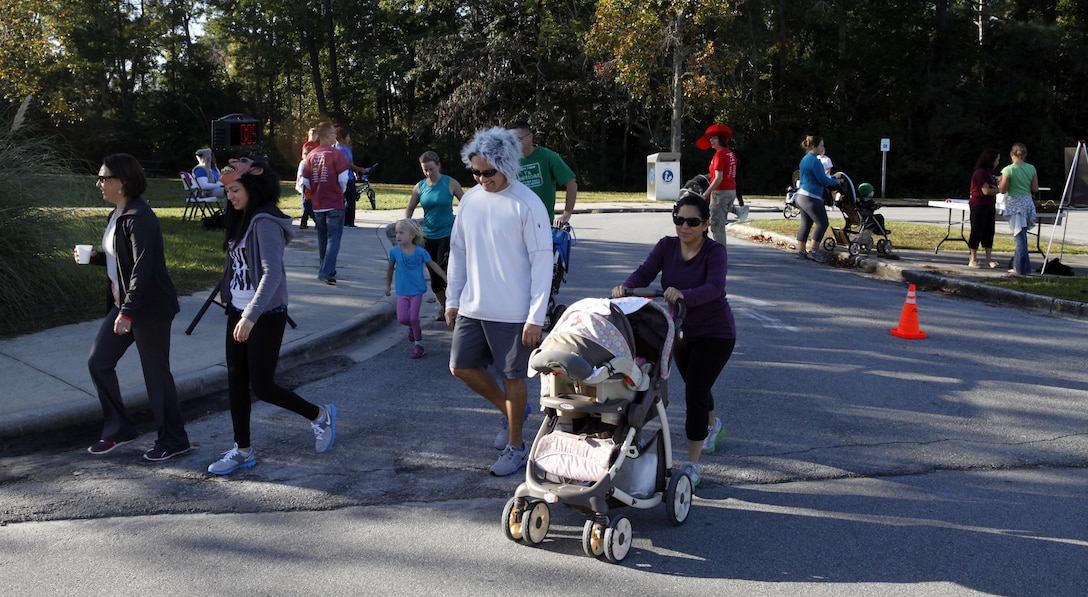 A military family runs as part of the monthly fun run at Tarawa Terrace aboard Marine Corps Base Camp Lejeune Oct. 20. The fun run is open to all ages and all abilities, and it encourages a healthy lifestyle through recreational fitness.