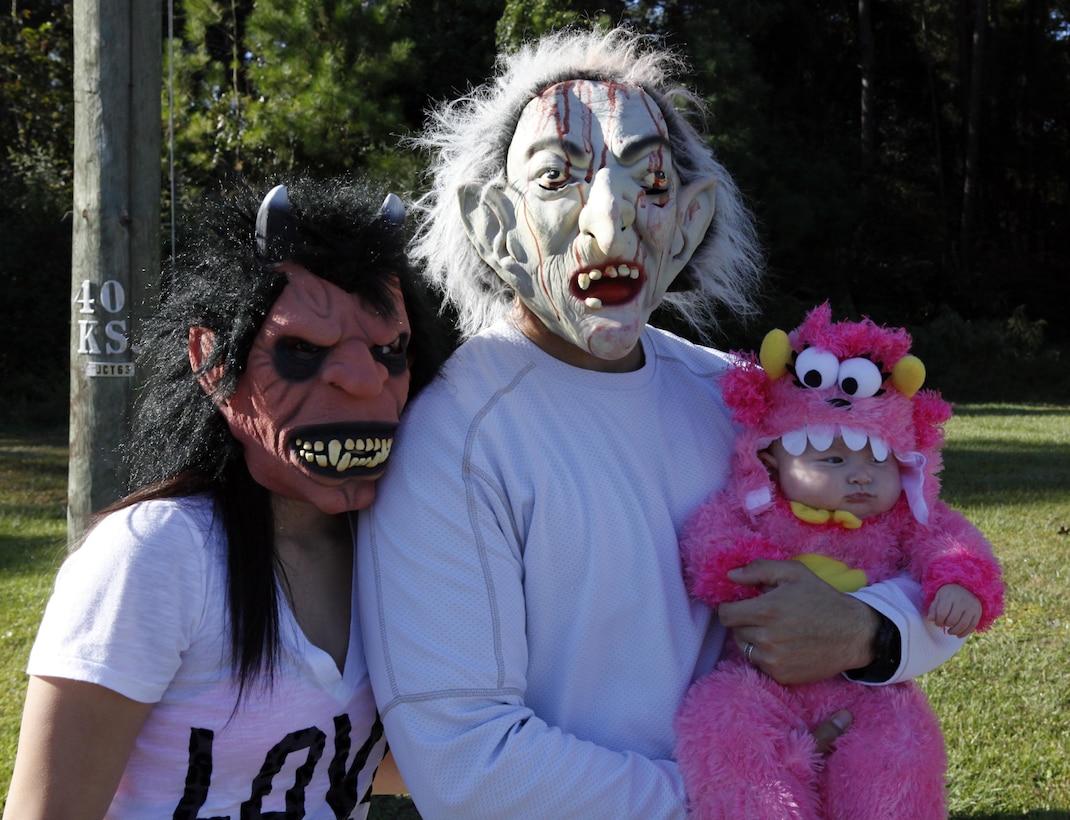 A Marine family in costume prepared to run at the monthly family fun run on Tarawa Terrace aboard Marine Corps Base Camp Lejeune Oct. 20. Fun runs are themed events and they give families and spouses time to be slightly silly while staying active through recreational fitness.