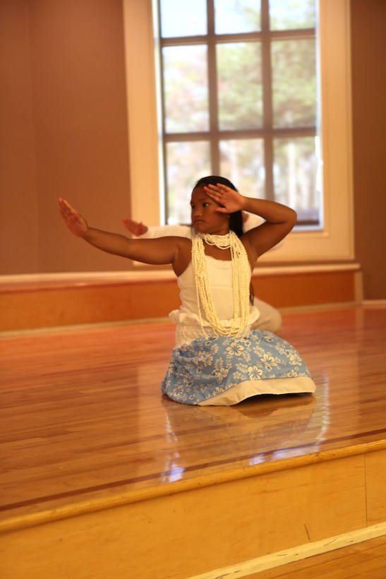 Dancers provided a visual treat with lively swirls and quick steps set to the beats and rhythms of their homes during Marine Corps Base Camp Lejeune's Multi-Cultural Heritage Day Oct. 24. They wore fun or traditional garb. Young women and children graced the stage displaying steps from Polynesian dances.