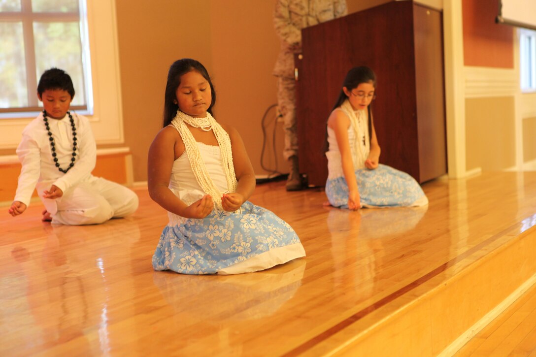 Dancers provided a visual treat with lively swirls and quick steps set to the beats and rhythms of their homes during Marine Corps Base Camp Lejeune's Multi-Cultural Heritage Day Oct. 24. They wore fun or traditional garb. Young women and children graced the stage displaying steps from Polynesian dances.