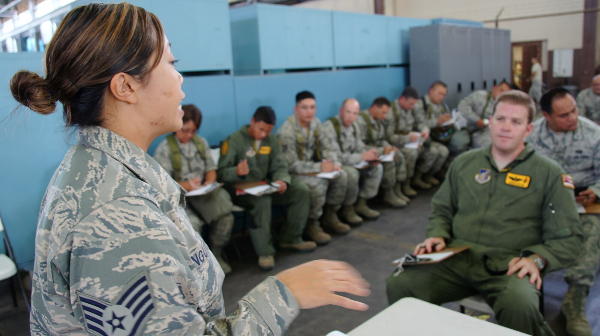 SSgt Cathlyn Nguyen, 154 Logistic Readiness Squadron, briefs Airmen from the Hawaii Air National Guard as part of a personnel deployment function line Nov. 7 during an exercise at Joint Base Pearl Harbor-Hickam, Hawaii. The PDF line tests the ability of Airmen to be medically, legally, administratively, spiritually, and financially ready to deploy, as well as the functionality of the processes in place with which to deploy them. (U.S. Air Force photo by Tech. Sgt. Andrew Jackson)
