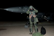 1st Lt. Andy Davis, 80th Fighter Squadron dons protective gear during exercise Beverly Bulldog 13-1 on Kunsan Air Base, Republic of Korea, Nov. 7, 2012. Davis needed the gloves and mask to be near his F-16 Fighting Falcon after finding out it was contaminated. (U.S. Air Force photo/Senior Airman Marcus Morris)