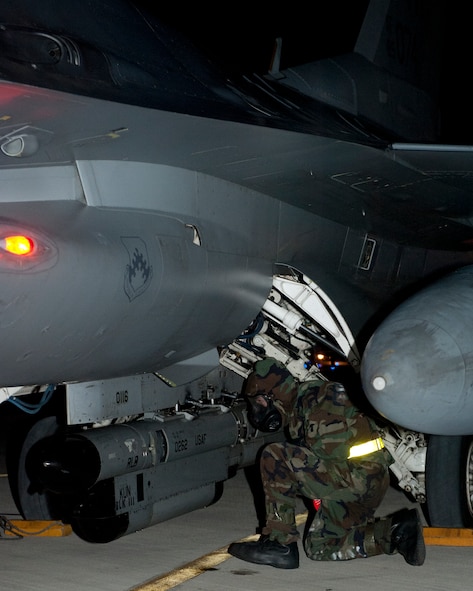 Airman Clifford Bould, 8th Aircraft Maintenance Squadron preps an F-16 Fighting Falcon for shutdown during exercise Beverly Bulldog 13-1 on Kunsan Air Base, Republic of Korea, Nov. 7, 2012. Bould dons  Mission Oriented Protective Posture gear in case the aircraft is contaminated. (U.S. Air Force photo/Senior Airman Marcus Morris)