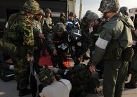 US and Republic of Korea air forces medical personnel assess the injuries of wounded role-players during Beverly Bulldog 13-1 on Kunsan Air Base, ROK, Nov. 7, 2012. The exercise presented US and ROK air force service members with various scenarios and assessed their ability to respond appropriately. (U.S. Air Force photo/Staff Sgt. Jonathan Fowler)