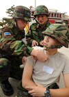 Republic of Korea air force medical personnel treat a simulated wound during Beverly Bulldog 13-1 on Kunsan Air Base, Republic of Korea, Nov. 7, 2012. The exercise assessed the combat and mission capabilities of US and ROK air forces. (U.S. Air Force photo/Staff Sgt. Jonathan Fowler)