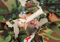 Republic of Korea air force medical personnel treat a simulated wound during Beverly Bulldog 13-1 on Kunsan Air Base, Republic of Korea, Nov. 7, 2012. The exercise assessed the combat and mission capabilities of US and ROK air forces. (U.S. Air Force photo/Staff Sgt. Jonathan Fowler)