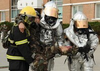US and Republic of Korea air forces firefighters carry a wounded ROKAF member following a simulated attack on Kunsan Air Base, Republic of Korea, Nov. 7, 2012. This was part of exercise Beverly Bulldog 13-1 which assessedresponse capabilities of US and ROK air forces. (U.S. Air Force photo/Staff Sgt. Jonathan Fowler)