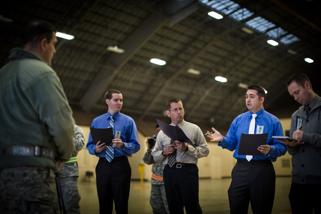 YOKOTA AIR BASE, Japan -- Band of the Pacific-Asia bandsmen pose as international news media for a simulated press conference with 374th Airlift Wing Commander Col. Mark August during an operational readiness exercise at Yokota Air Base, Japan, Nov. 6, 2012. The press conference gave a chance for August to practice answering challenging questions and convey the wing's mission truthfully, accurately, and eloquently. (U.S. Air Force photo/Staff Sgt. Josh Voyles)