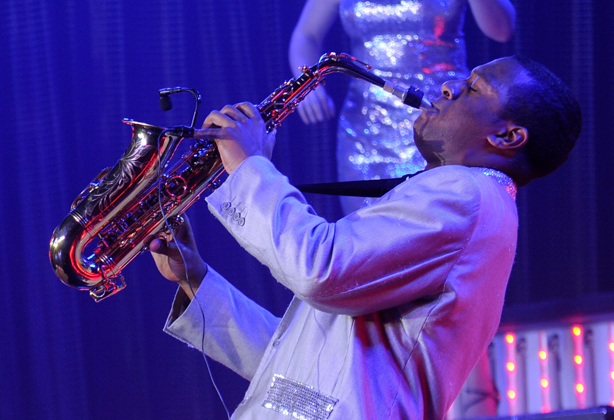 Airman 1st Class Wynton Warren, 18th Communications Squadron cyber systems operations journeyman, plays the alto saxophone during a Tops in Blue performance at the Northern Quest Casino and Resort in Airway Heights, Wash., Nov. 6, 2012. “Tops in Blue” visits Fairchild nearly once a year, with a new theme and show each time. This year the 2012 World Tour is entitled “Listen!” Inviting the audience “to listen to the music of life through the sounds we hear every day.” (U.S. Air Force photo by Airman 1st Class Ryan Zeski)