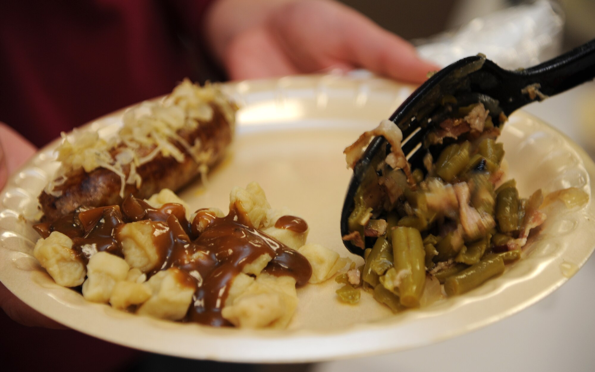 Volunteers from the 33rd Flying Training Squadron served 161 hungry guests during the October Singles’ International Gourmet Meal Opportunity Oct. 29 in the Community Chapel Activity Center at Vance Air Force Base, Okla. The menu theme was “Oktoberfest” and featured a variety of German foods. (U.S. Air Force photo/ Airman 1st Class Frank Casciotta)