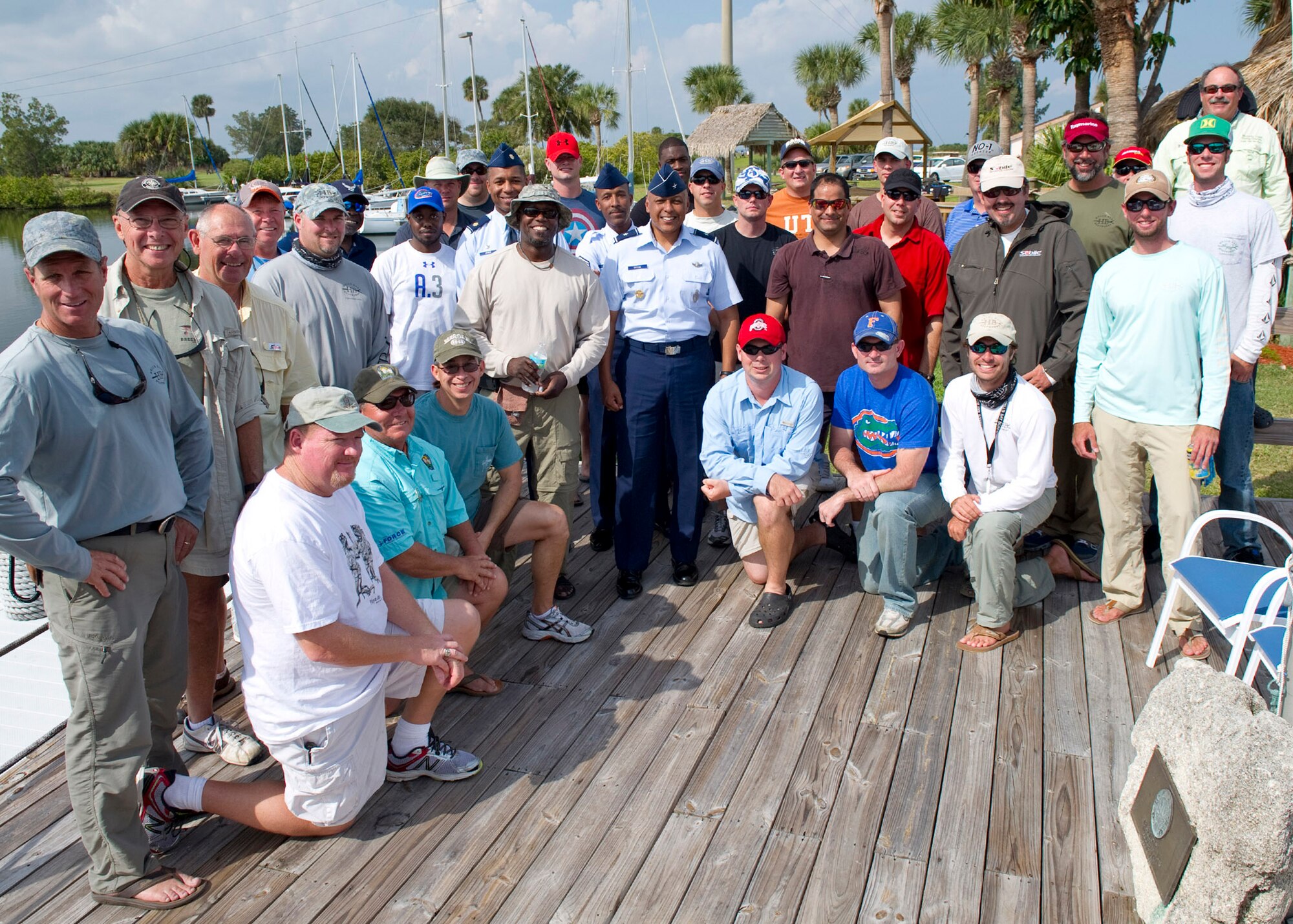 Brig. Gen. Anthony Cotton, 45th Space Wing, commander, poses with Chief Master Sergeant Herman Moyer, 45th Space Wing Command Chief, Maj. Gregory Jones, 45th Force Support Squadron, commander, and members of the crew for the "American Hero Experience."