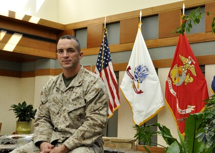 Lance Cpl. Landon Beaty poses in the atrium of the Charles C. Carson Center
for Mortuary Affairs, Dover Air Force Base, Del., Oct. 30, 2012. Beaty is one of two Marines at the mortuary who serve as Marine Corps liaisons to the families of fallen Marines. (U.S. Air Force Photo/ Staff Sgt. Caitlin Jones)
