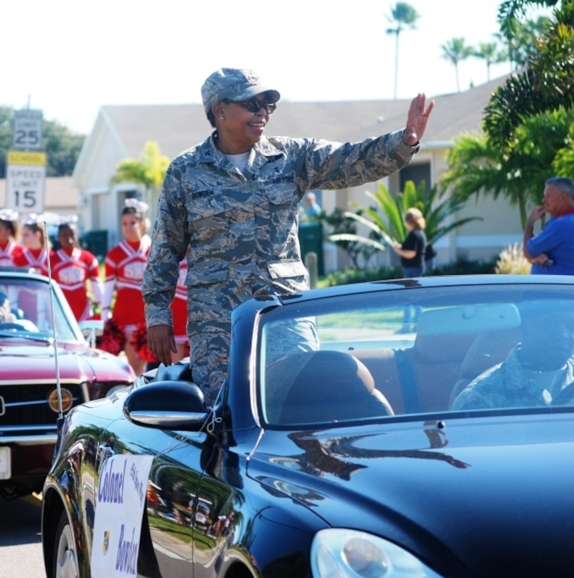 Col. Allison Bowden, commander, 45th Medical Group, waves to the crowd during the annual Founder’s Day Parade held in Satellite Beach Saturday morning.