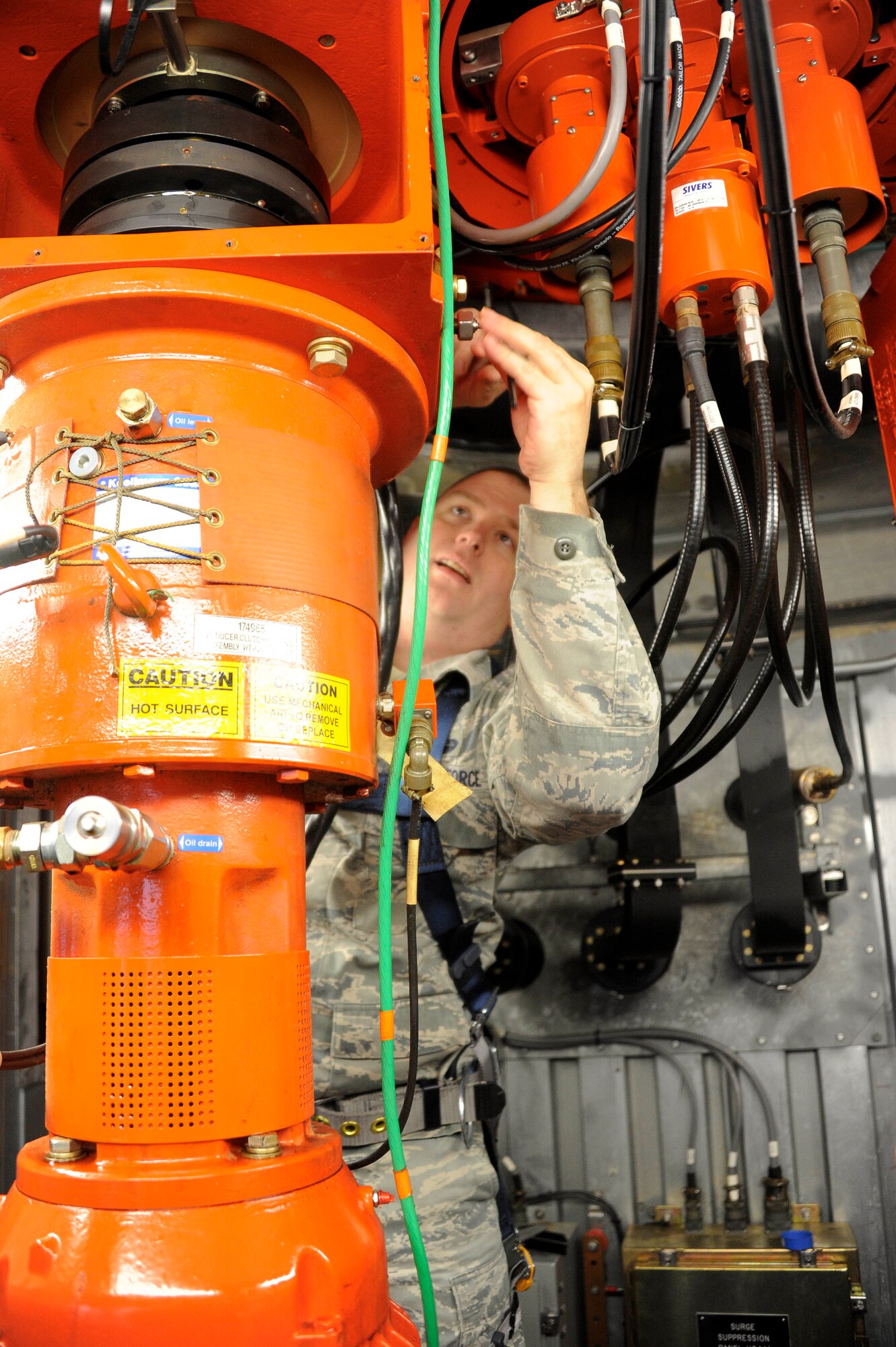 Tech. Sgt. Benjamin Buchholz, 87th Communication Squadron ground radar craftsman, re-engages the motors of the digital air surveillance radar dish Oct. 30, 2012, here. The dish was shut down during the storm because all flight operations were canceled and to reduce damage. (U.S. Air Force photo by Airman 1st Class Ryan Throneberry/Released)