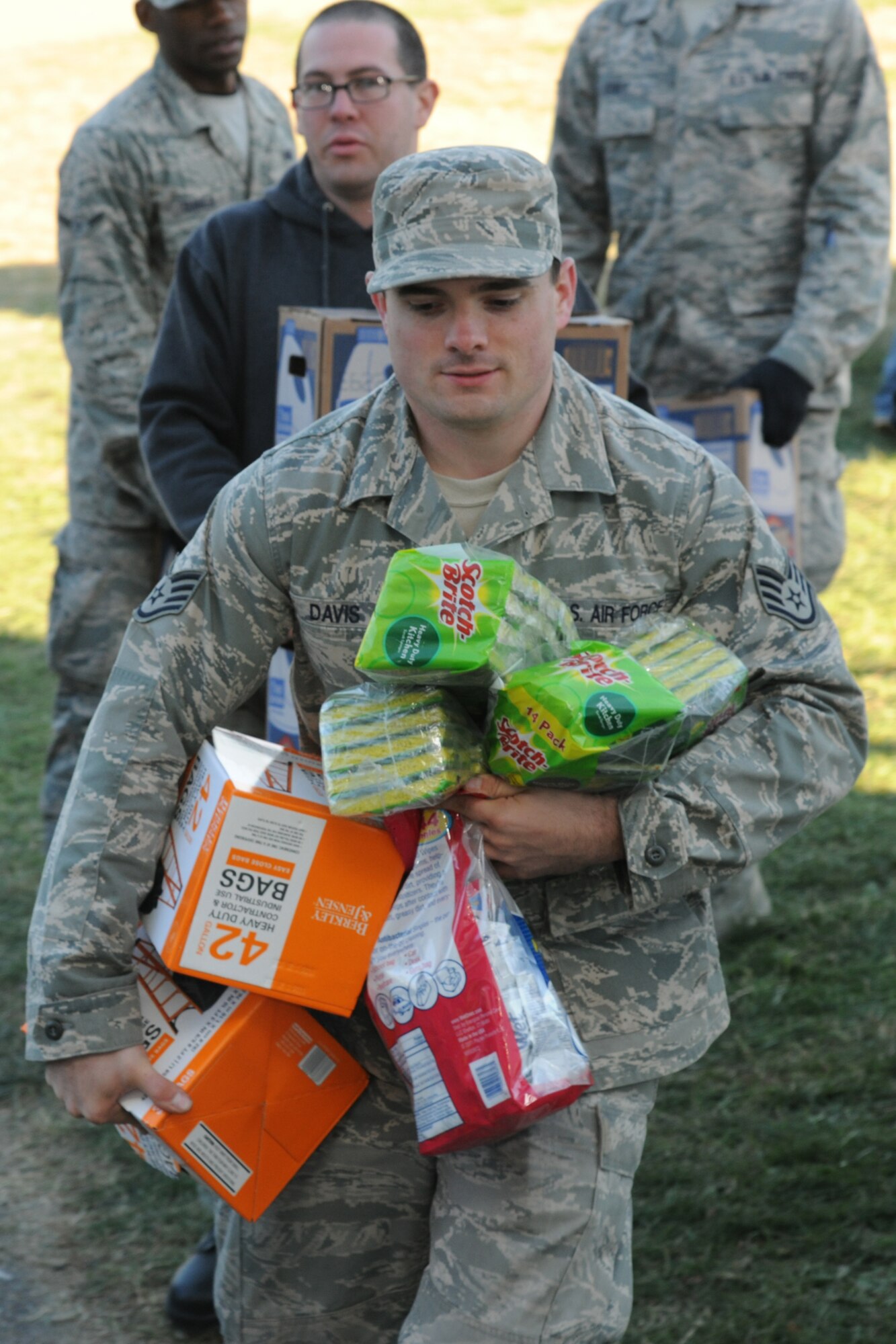 LINFORD, N.J. -- U.S. Air Force Staff Sgt. James Davis hauls donated aid supplies to the Thompson Park Community Center in Monmouth County, N.J. Nov. 6. Davis, a native of Warren, Ohio, assigned to the 305th Aerial Port Squadron at Joint Base McGuire-Dix-Lakehurst, N.J., joined members of the base honor guard to assist in collection efforts to aid Monmouth County, N.J., residents impacted by Hurricane Sandy. (U.S. Air Force photo by Tech. Sgt. Zachary Wilson/Released)