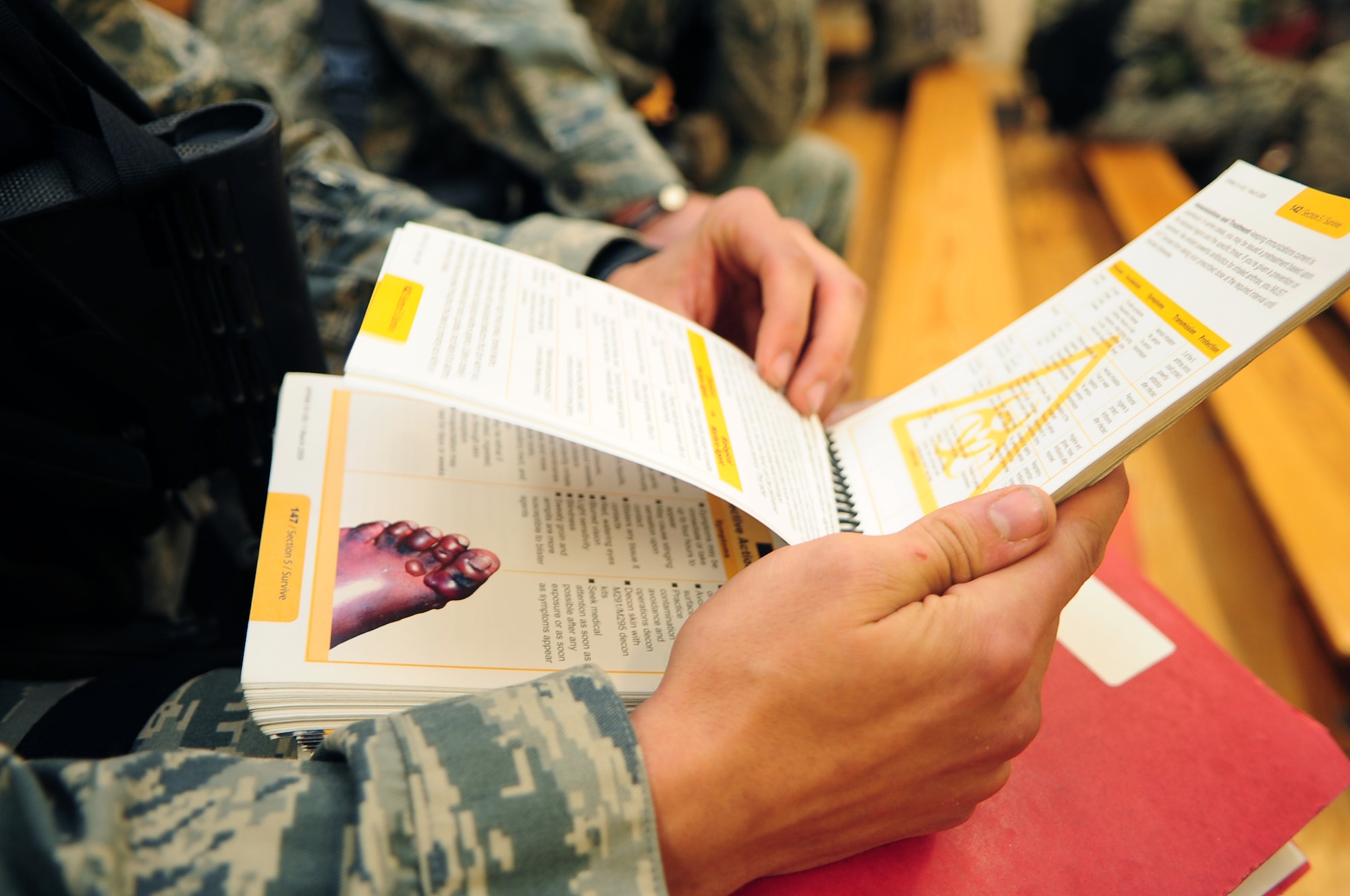 A U.S. Air Force Airman assigned to the 4th Security Forces Squadron reviews his Airman’s Manual during Operational Readiness Exercise Coronet Warrior 12-05 on Seymour Johnson Air Force Base, N.C., Nov. 5, 2012. The pocket-sized reference guide contains information about war skill tactics, techniques and procedures. (U.S. Air Force photo/Airman 1st Class Aubrey White/Released)