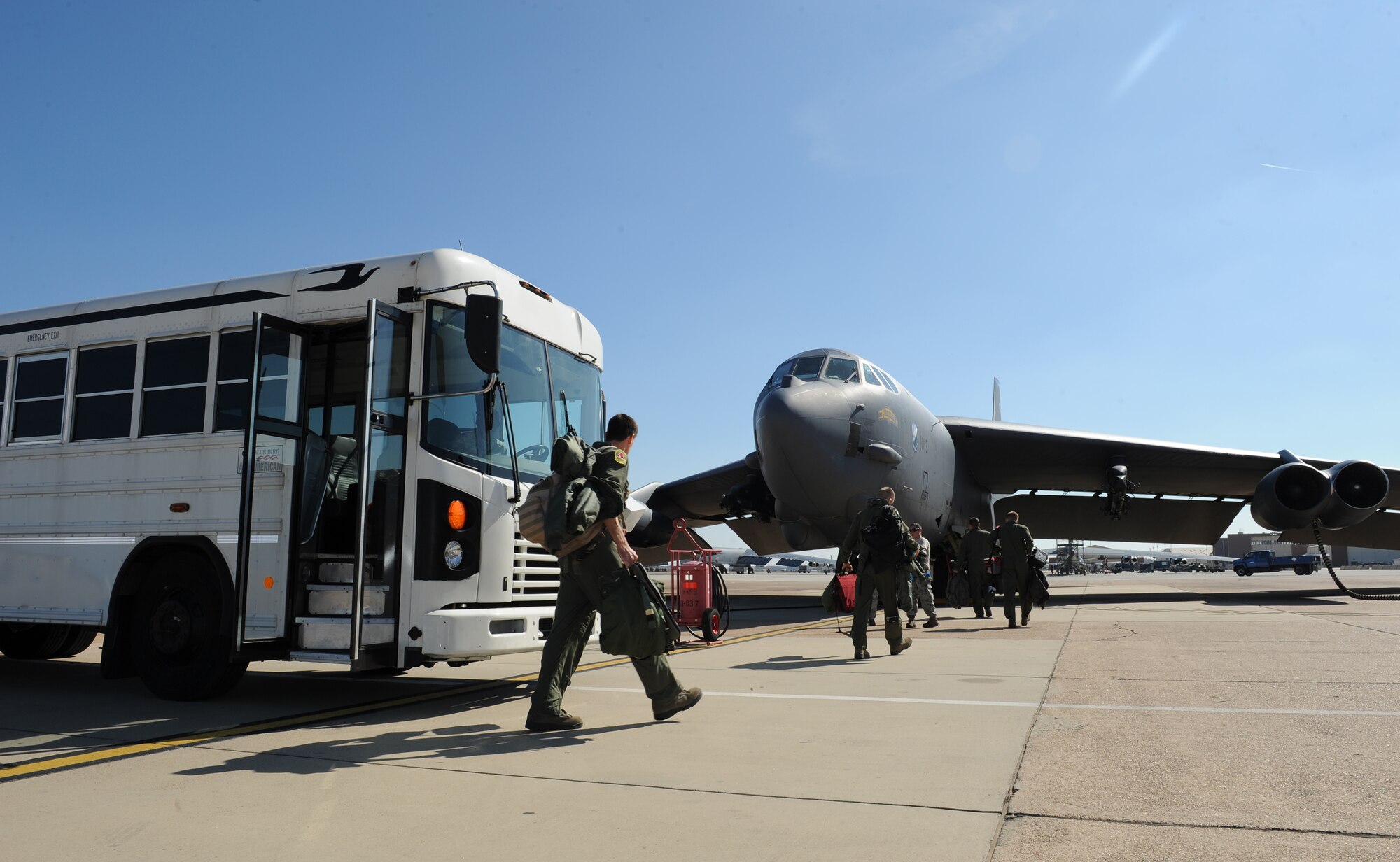 Aircrew members exit a bus operated by Staff Sgt. Anthony Jones Jr., 2nd Logistics Readiness Squadron Vehicle Operations craftsman, on Barksdale Air Force Base, La., Nov. 6. Vehicle operators support the Barksdale mission by driving aircrew to and from their aircraft as well as perform several other vital tasks. (U.S. Air Force photo/Airman 1st Class Benjamin Gonsier)(RELEASED)
