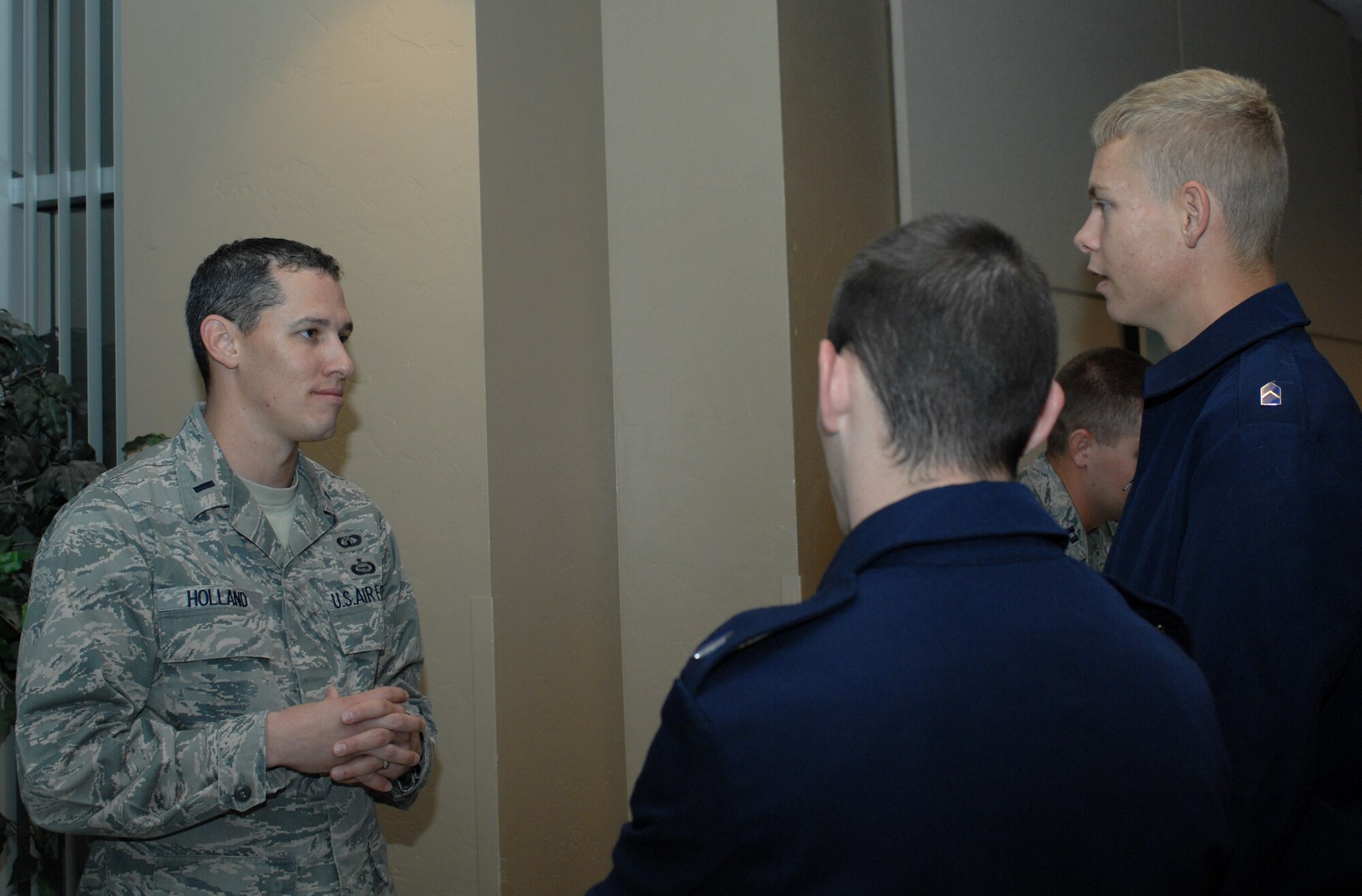 U.S. Air Force 1st Lt. Rolland Holland, 355th Operation Support Squadron Airfield Operations Flight commander, talks with University of Arizona ROTC cadets about his career field in the Air Force at a Career day held at the UofA campus Nov. 6, 2012. Officers from Davis-Monthan Air Force Base, Ariz., from many Air Force specialty codes, volunteered to give cadets insight into different career fields during the event. (U.S. Air Force photo by Airman 1st Class Saphfire Cook/Released)