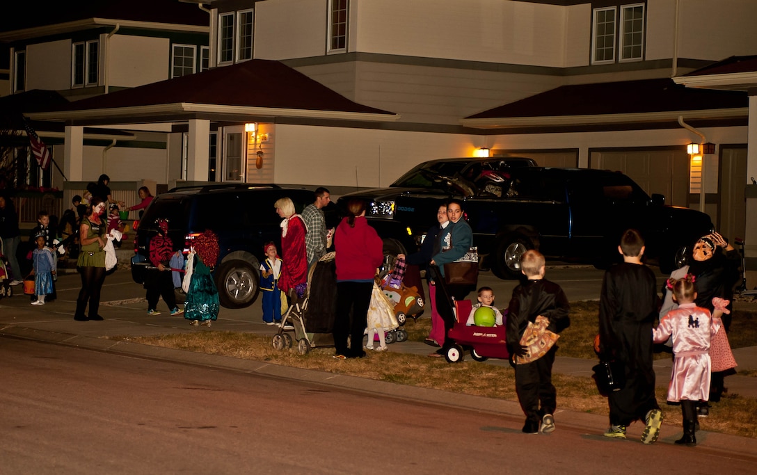 Youths of all ages sporting a variety of costumes filled the streets during Halloween at Ellsworth Air Force Base, S.D., Oct. 31, 2012. Volunteers from a variety of organizations teamed up to ensure the safety of children and their families as they went door-to-door throughout the evening. (U.S. Air Force photo by Airman 1st Class Zachary Hada/Released)