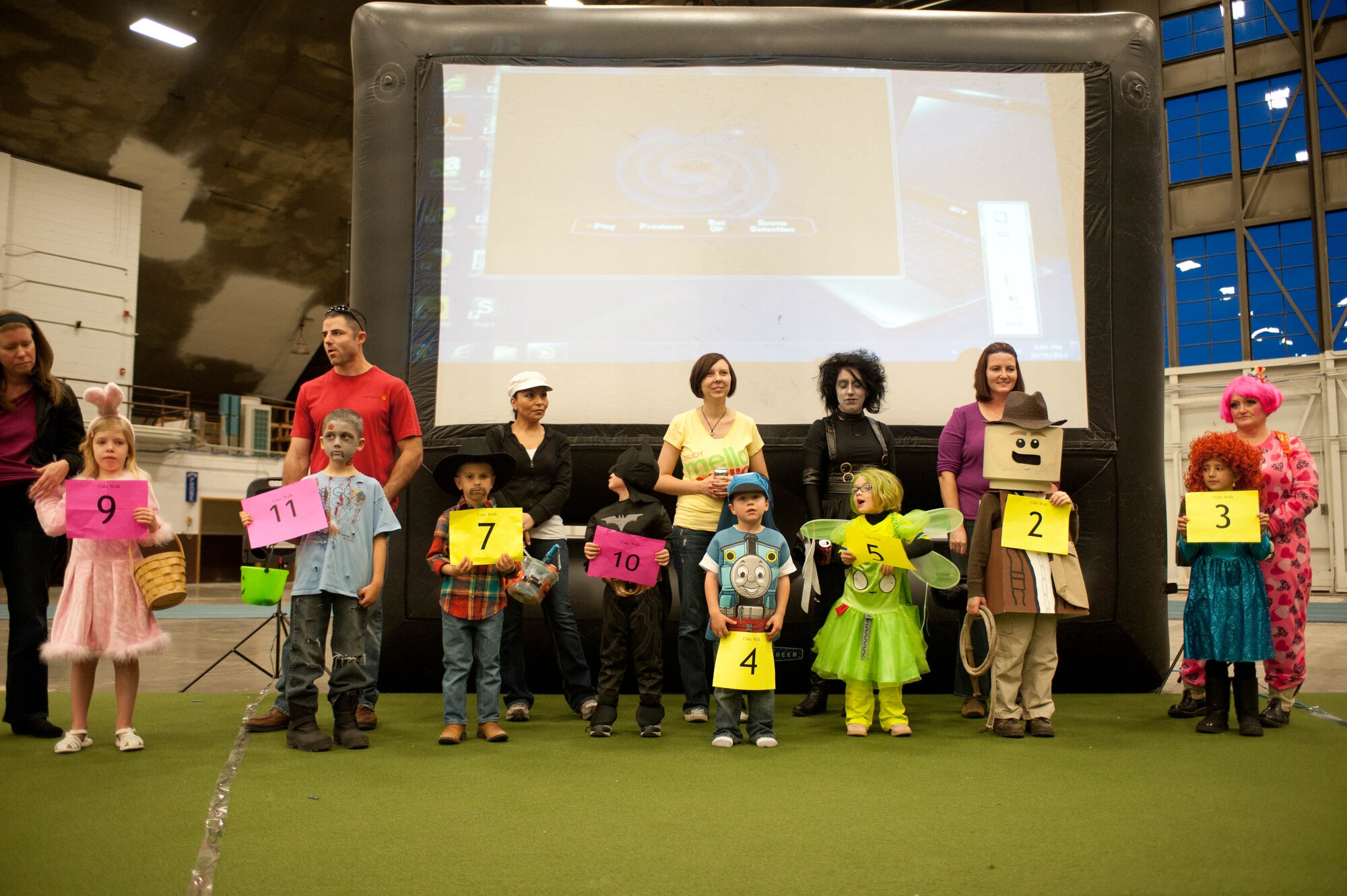 Children line up for a costume contest judged by the 28th Bomb Wing Chapel staff during the Fall Festival at Ellsworth Air Force Base, S.D., Oct. 31, 2012. The 28th BW Chapel hosted the festival and a variety of other events to show appreciation for the many sacrifices Airmen and their families make, and to strengthen the bond between Ellsworth families. (U.S. Air Force photo by Airman 1st Class Zachary Hada/Released)