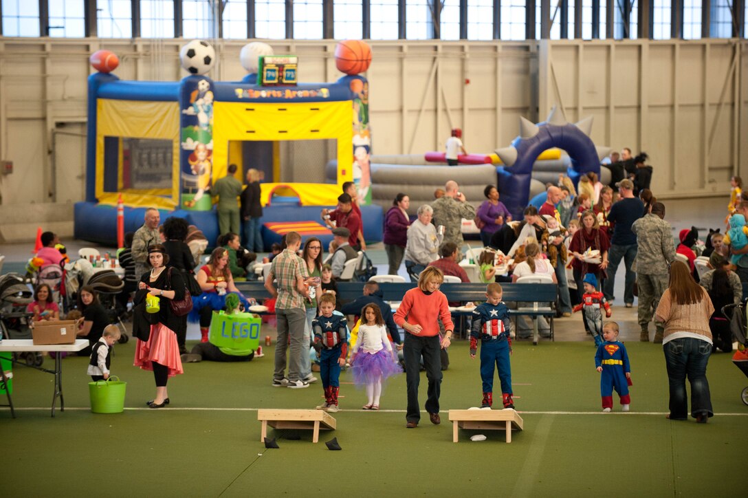 Airmen, families and friends enjoys a variety of events and activities during the Fall Festival hosted by 28th Bomb Wing Chapel staff in the Pride Hangar at Ellsworth Air Force Base, S.D., Oct. 31, 2012. The festival was a way people could celebrate autumn without tying it to a single holiday. (U.S. Air Force photo by Airman 1st Class Zachary Hada/Released)
