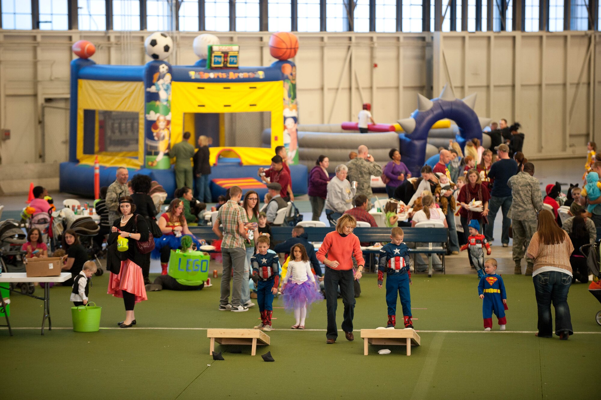 Airmen, families and friends enjoys a variety of events and activities during the Fall Festival hosted by 28th Bomb Wing Chapel staff in the Pride Hangar at Ellsworth Air Force Base, S.D., Oct. 31, 2012. The festival was a way people could celebrate autumn without tying it to a single holiday. (U.S. Air Force photo by Airman 1st Class Zachary Hada/Released)