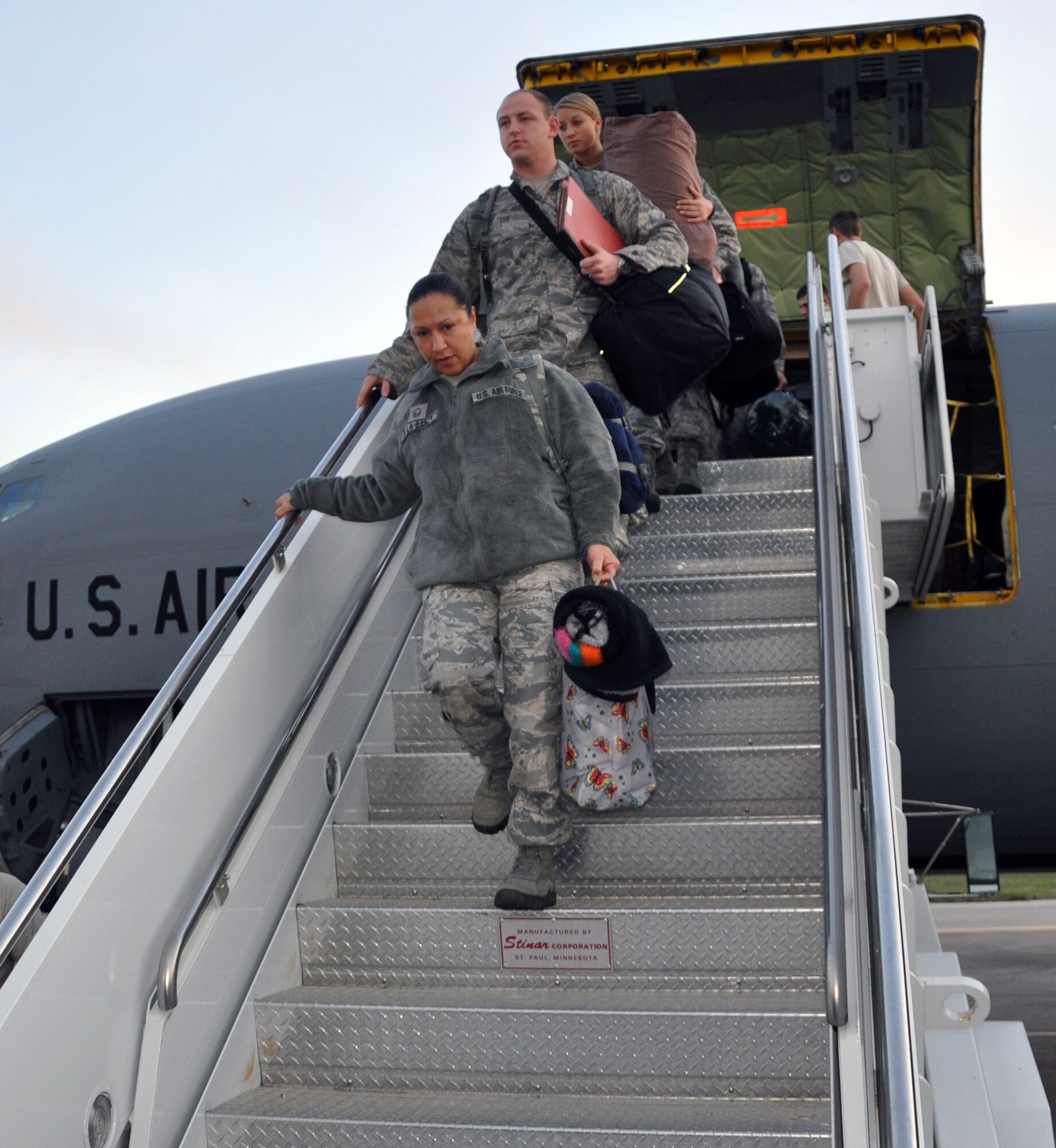 Members of the Air Force Reserve 931st Air Refueling Group deboard a KC-135 Stratotanker after arriving at their deployed location in Southwest Asia.  While deployed, the Reservists will be assigned to the 90th Expeditionary Air Refueling Squadron under the 385th Air Expeditionary Group in the theater of operations. The 90th EARS is a total-force team consisting active-duty, Reserve, and Air National Guard Airmen. (U.S. Air Force photo by 1st Lt. Zach Anderson)