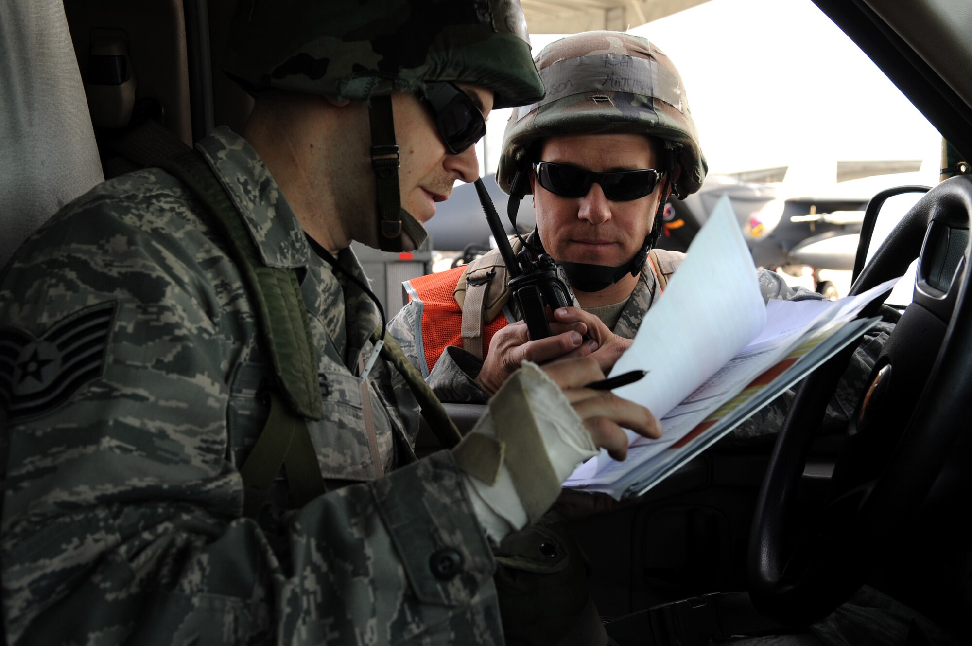 U.S. Air Force Tech. Sgt. Grant Ellis, 391st Aircraft Maintenance Unit crew chief flightline expeditor, checks in with Tech. Sgt. Matthew Carlson, 391st AMU, during an Operational Readiness Exercise November 6, 2012 at Mountain Home Air Force Base, Idaho. As a flightline expeditor, Ellis coordinates what items are needed to fix a jet when it is broken and have the tools on hand for crew chiefs when they arrive at the aircraft. Because of the expeditor’s preparation, an eight-hour job can be reduced to six hours, which can be vital for mission success and especially important while deployed. (U.S. Air Force Photo by Staff Sgt. Roy Lynch III/Released)