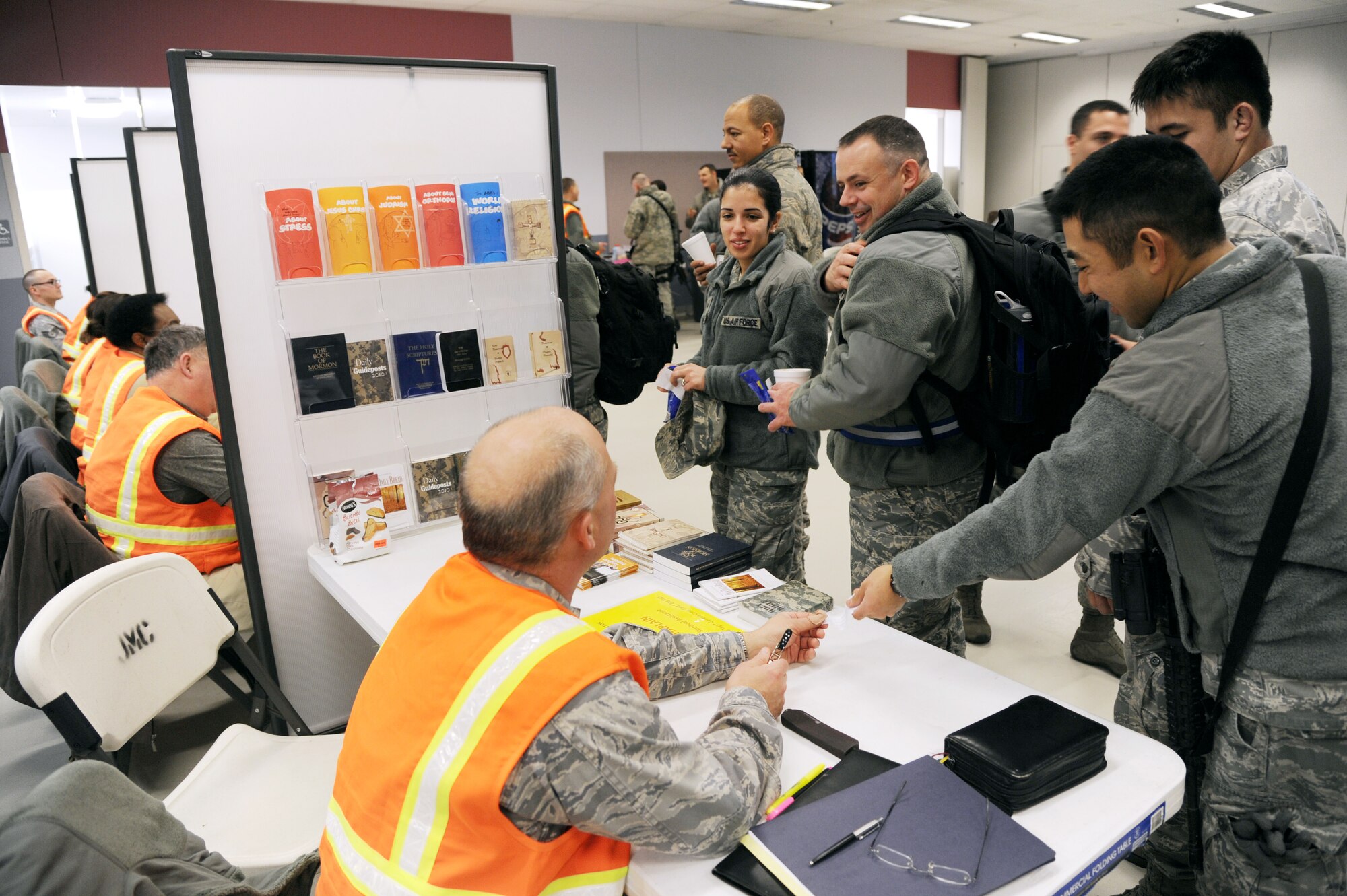 Icemen assigned to the 354th Fighter Wing process through the personnel deployment function line during an operational readiness exercise Nov. 6, 2012, Eielson Air Force Base, Alaska.  The line provides Airmen a chance to verify information and create important documents such as wills and powers of attorney.  (U.S. Air Force photo/Staff Sgt. Jim Araos)