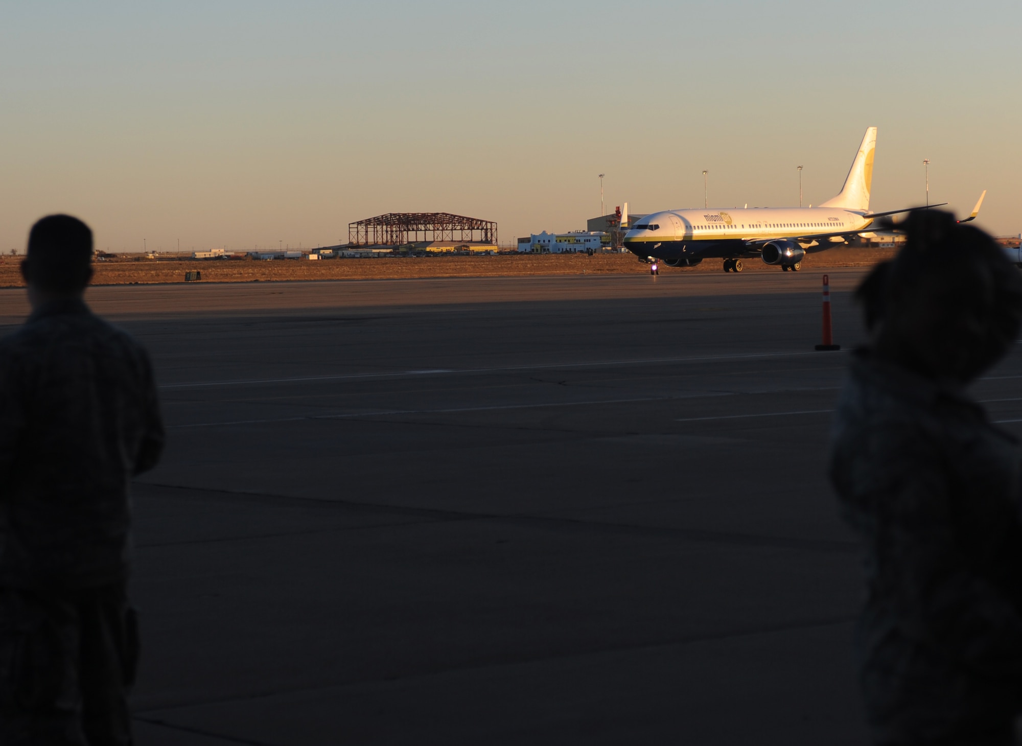 A plane full of redeployers taxis back onto the flightline during Operation Homecoming at Cannon Air Force Base, N.M., Nov. 6, 2012. Operation Homecoming is a monthly event held to welcome Air Commandos back from worldwide deployments and reunite them with family and friends. (U.S. Air Force photo/Airman 1st Class Xavier Lockley) 