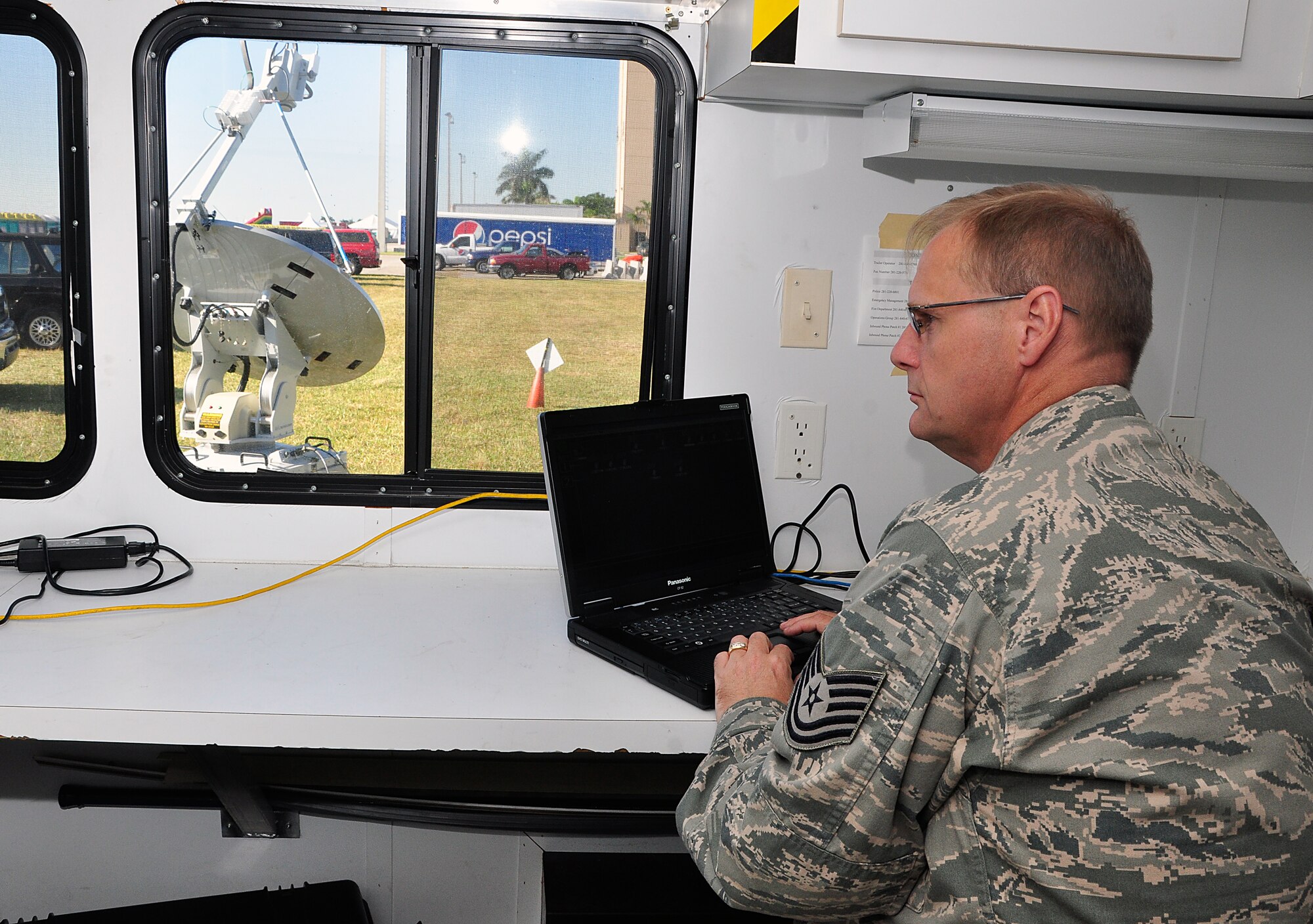 Technical Sgt. Frank Hartely, 482nd Communications Squadron cyber transport non-commissioned officer in charge, verifies the Joint Incident Site Communications Capability (JISCC) network connections during the Wings Over Homestead Airshow Nov. 4. During the show, Airmen assigned to the 482nd Communications Squadron set up and maintained the JISCC to provide radio communications for police, fire fighters, first responders, performers, air traffic controllers, and the air boss. (U.S. Air Force photo/Technical Sgt. Robert Gipson)