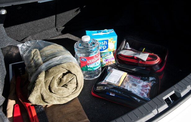 A winter driving safety kit is spread out to show the essential items at Ellsworth Air Force Base, S.D., Oct. 31, 2012. In the event of an emergency situation, a winter driving safety kit can mean the difference of life or death. Items of a survival kit can vary, but all should include water, blankets, jumper cables, ice scraper, basic tools, cat litter for tire traction, a shovel, a first aid kit, and non-perishable food items. (U.S. Air Force photo by Airman 1st Class Alystria Maurer/Released) 

