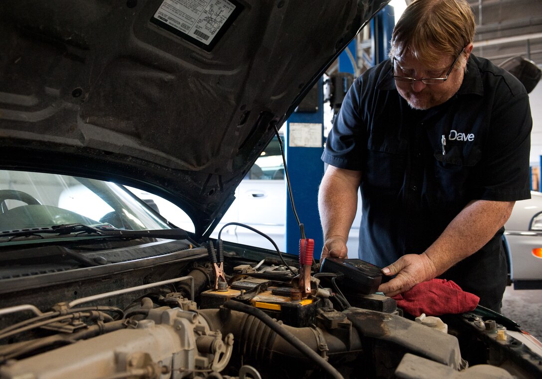 Dave Roney, 28th Force Support Squadron auto hobby shop manager, checks the amperage of a car battery during winter vehicle inspections at the auto hobby shop on Ellsworth Air Force Base, S.D., Oct. 23, 2012. Motorists should not only ensure their vehicles are ready for cold temperatures, but also have a winter safety kit in their vehicles in the event of an emergency. (U.S. Air Force photo by Airman 1st Class Alystria Maurer/Released)