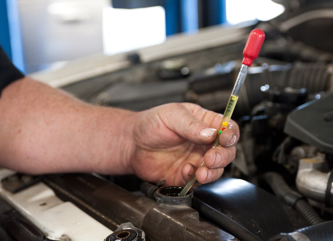 Dave Roney, 28th Force Support Squadron auto hobby shop manager, tests the density of antifreeze in a vehicle to ensure it can withstand cold temperatures at the auto hobby shop on Ellsworth Air Force Base, S.D., Oct. 23, 2012. Motorists can ensure their vehicles are ready for winter by checking their vehicle’s battery, tires, exhaust system, and other key areas. For more information about vehicle winterization, call the auto hobby shop at (605) 385-2900. (U.S. Air Force photo by Airman 1st Class Alystria Maurer/Released)